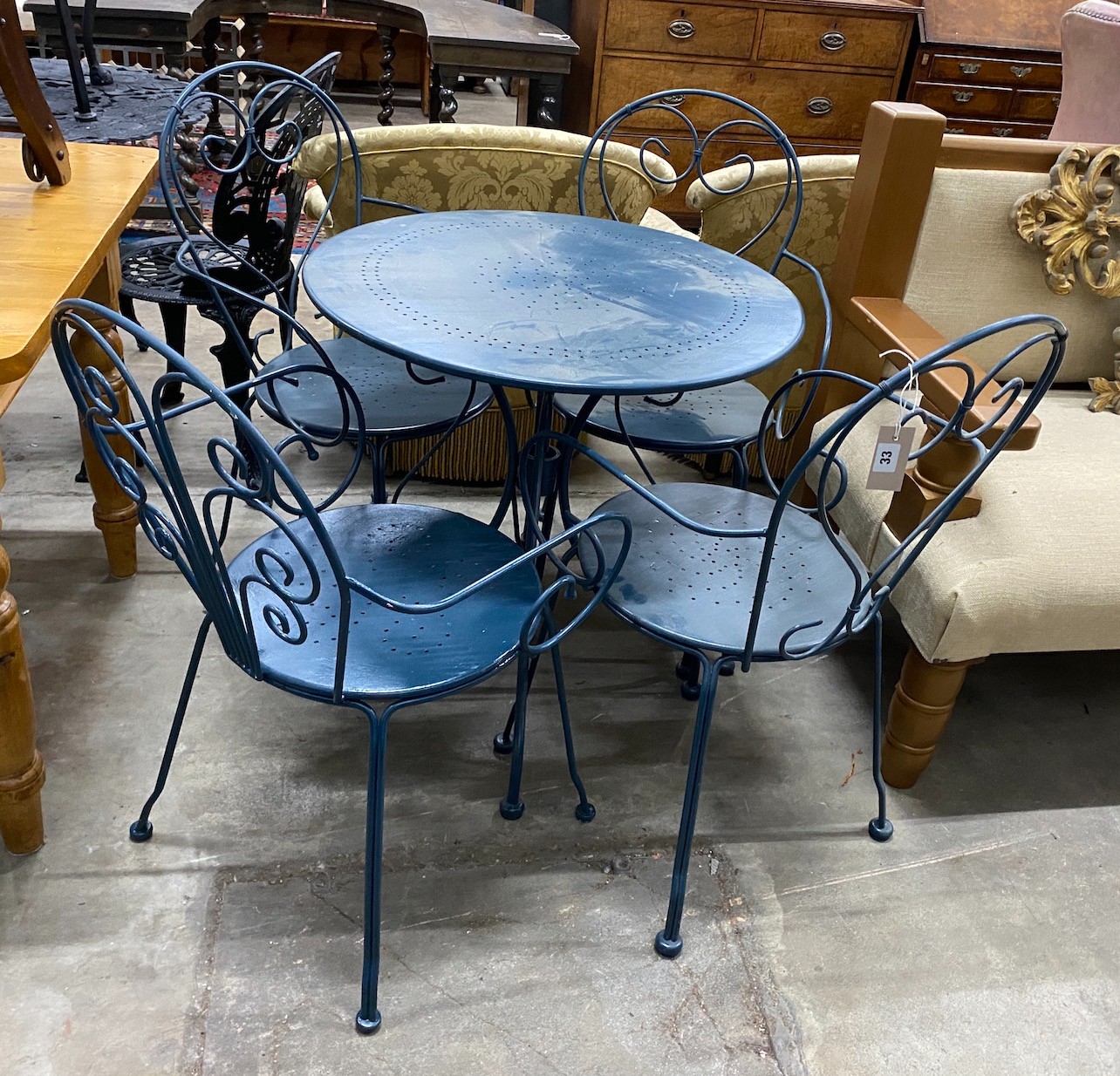 A circular painted aluminium garden table, diameter 70cm, height 72cm and four chairs